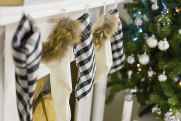 Fototapeta na wymiar Christmas stockings over the fireplace