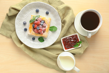 Composition with berry puff pastry on table