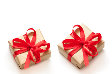 Festive packaging wallpaper. Two gift boxes, tied with red ribbons and bows