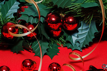 Christmas red balls, tinsel on a red background.
