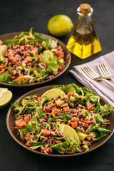 Salad with wild rice, papaya, lime and cucumber.