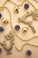 gold reindeer with bead and pine cone in christmas concept