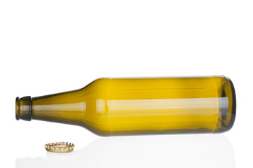 Empty beer bottle on white background