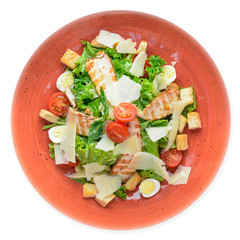 Caesar salad with chicken and fresh vegetables.
