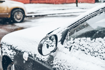 cleaning car from a snow