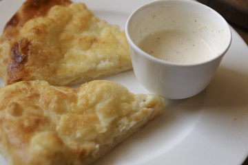 Hot tortilla with cheese and bechamel sauce. Khachapuri, Caucasian kitchen. Restaurant Shot.
