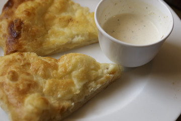 Hot tortilla with cheese and bechamel sauce. Khachapuri, Caucasian kitchen. Restaurant Shot.
