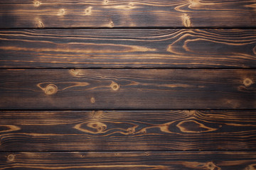 Dark brown and yellow brushed burnt wooden planks for background