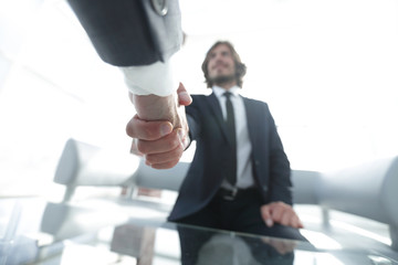 Close-up of two business people shaking hands