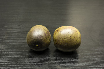 Two fruits of Passiflora edulis.