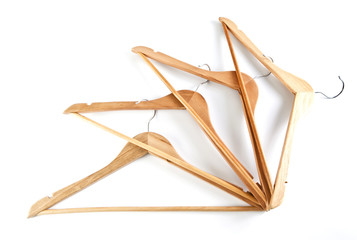 Wooden hangers for clothes on a white background.