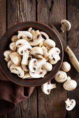 Fresh mushrooms on wooden table, top view