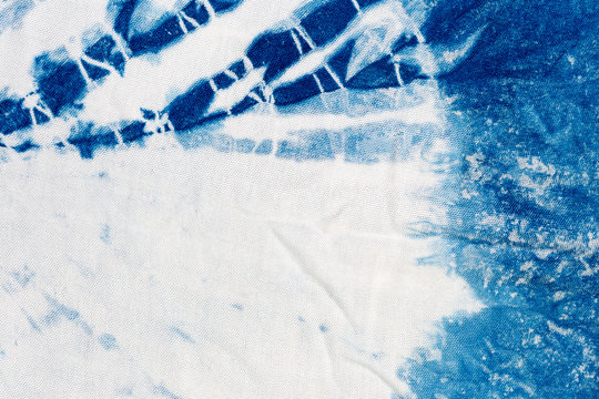 The fabric indigo tie dye as a background and texture.