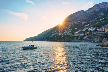 Sunset and Yacht at Amalfi town in Tyrrhenian sea