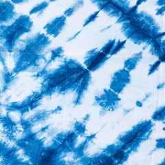 The fabric indigo tie dye as a background and texture.