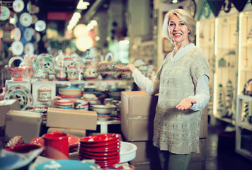 woman buying ceramic ware