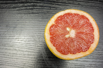 Split pink grapefruit.