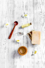 Organic skin care. Soap, gel and salt on wooden table background