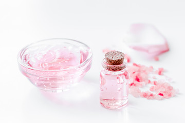 rose organic cosmetics with salt, cream and oil on white table b