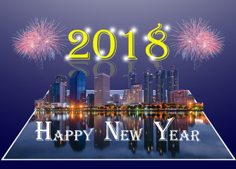 Happy New Year 2018 background with beautiful firework celebration in high modern building at downtown in the city for greeting card 2018 or happy new year 2018 card. - Powered by Adobe