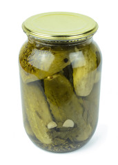 Pickled cucumbers in a glass jar isolated on white