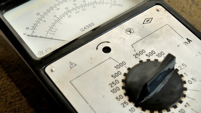 Electric Voltage Meter.Electrician using voltmeter for checking office equipment