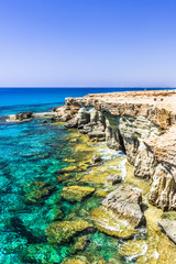 Fototapeta na wymiar Blue waters along the rocky shores of Cyprus