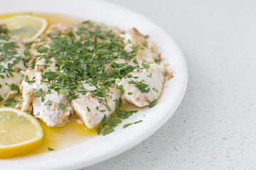 Close up of a dish with fish fillets.