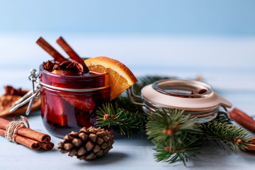 Mulled wine in a glass. Christmas hot mulled wine in a glass with spices and citrus fruit. Mulled...