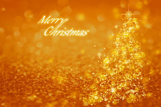 Christmas tree with flares, lights, snowflakes on a golden, shiny background with the words Merry Christmas