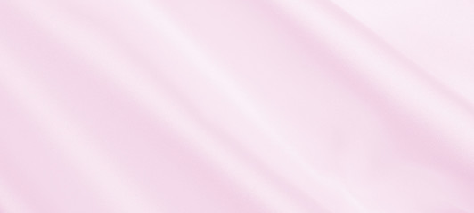 Smooth elegant pink silk or satin texture as wedding background. Luxurious background design