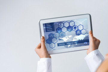 Close of female doctor hands working with tablet pc computer