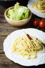Italian pasta spaghetti with oil, garlic and chili, selective focus