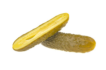 One pickled cucumber cut in half on white background