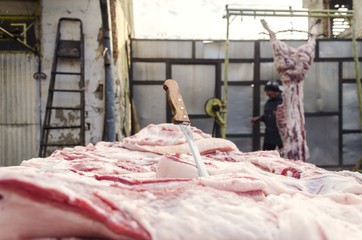 pig meat processing with knife