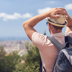 Traveler in sunhat is enjoying a beautiful view.