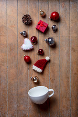 White cup and Christmas gifts