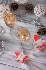 Wine glasses with champagne on a white background, festive evening, new year, Christmas