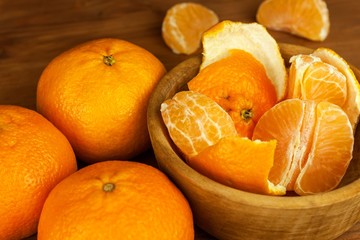 Fresh mandarins on a wooden table. Selling fruit. Vitamins against flu and cold. Advertising for tangerines.