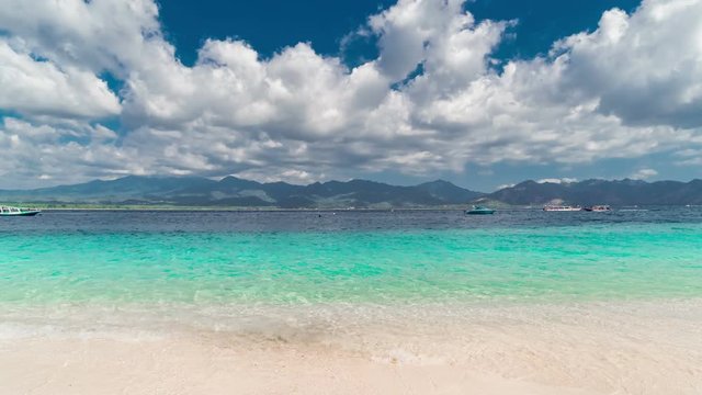 Timelapse tropical island and azure beach with sky and clouds on Gili island, Indonesia