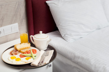 Breakfast in bed in hotel room