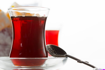 Turkish tea in traditional glass isolated on white background