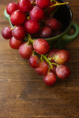 ceramic bowl filled by bunch of fresh grapes