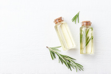 Organic cosmetics with extracts of herbs rosemary on white background.