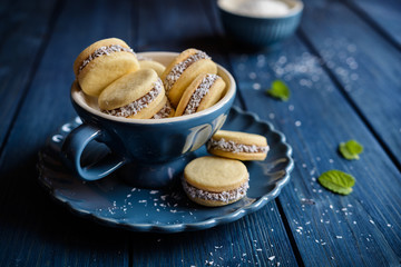 Alfajore cookies filled with caramelized milk and coconut