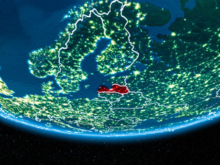 Latvia on planet Earth from space at night