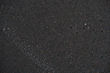 Black Sand beach macro photography. Shadows play in this evening macro shot of a black sand beach.