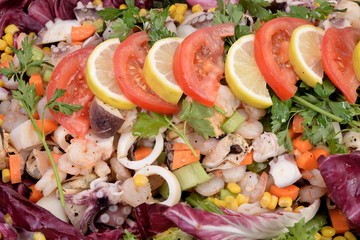 Black dish with seafood salad