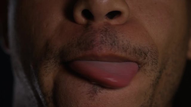 Close up of male mouth licking his lips