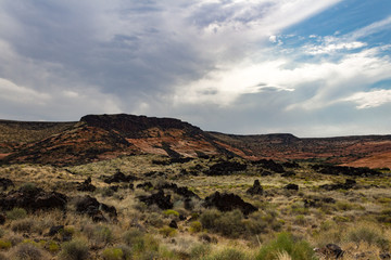 Beautiful lava fields and Navajo sandstone hills of Snow Canyon State Park in Utah.